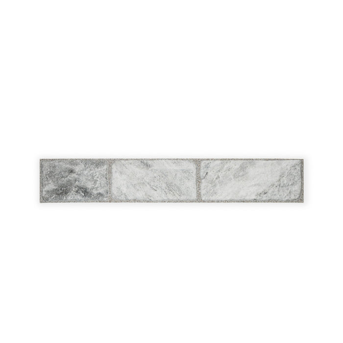 A singular row of Cavo Porcelain Cladding. The colour is a darkish grey with a marbled effect.