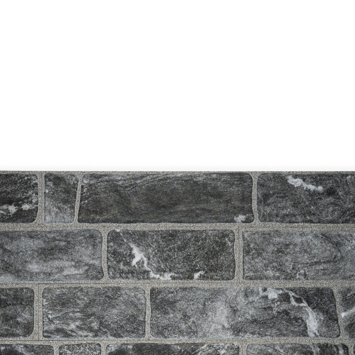 An example of a section of Monviso porcelain cladding. The colour is dark grey and the texture is marbled.