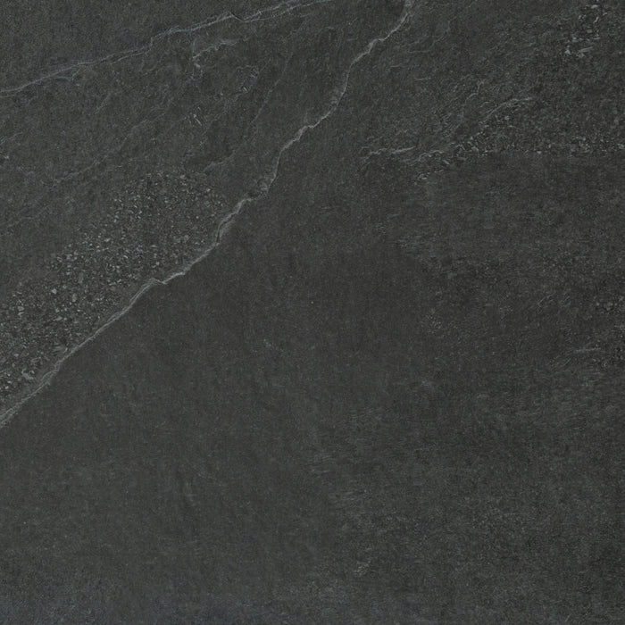 A close up of a dark grey Saltoro porcelain paving slab.