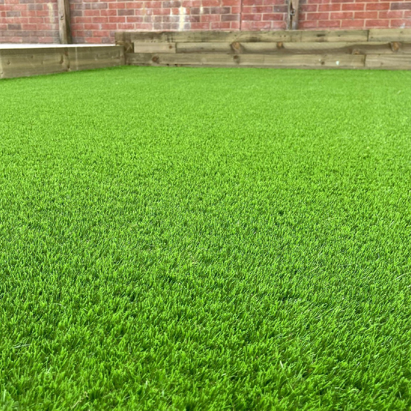 Garden scene with Trafford Artificial Grass from Select Living Group.