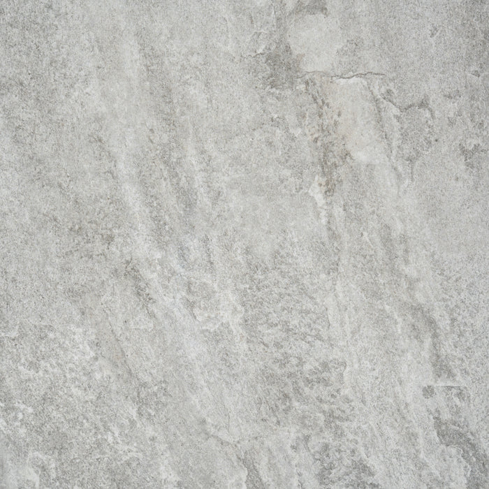 An example of the texture on Cavo Porcelain Paving. The colour is a darkish grey with a marbled effect.