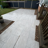 Select Living Group Cristallo Beige Porcelain Paving patio steps and garden area.