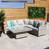 Outdoor patio set with a sectional sofa and coffee table on Solaro Light Grey Porcelain Paving from Select Living Group.