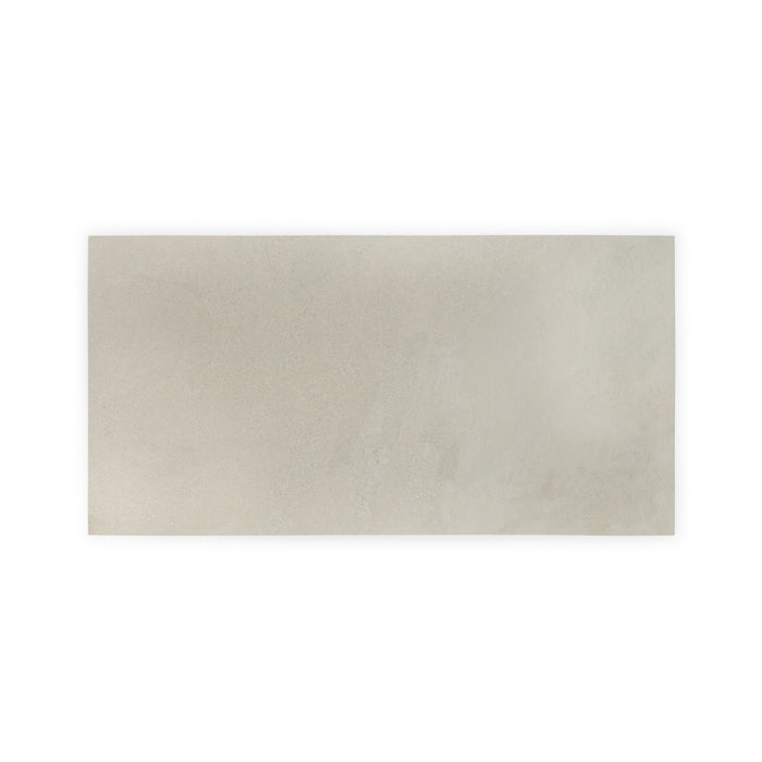 A wider shot of a single beige Saltoro porcelain paving slab, on a white background. 