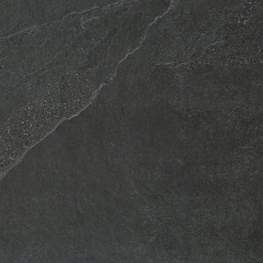 A close up of a dark grey Saltoro porcelain paving slab. 