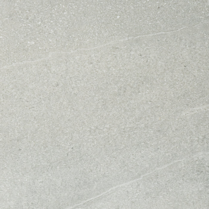 A close up of a light grey Saltoro porcelain paving slab. 